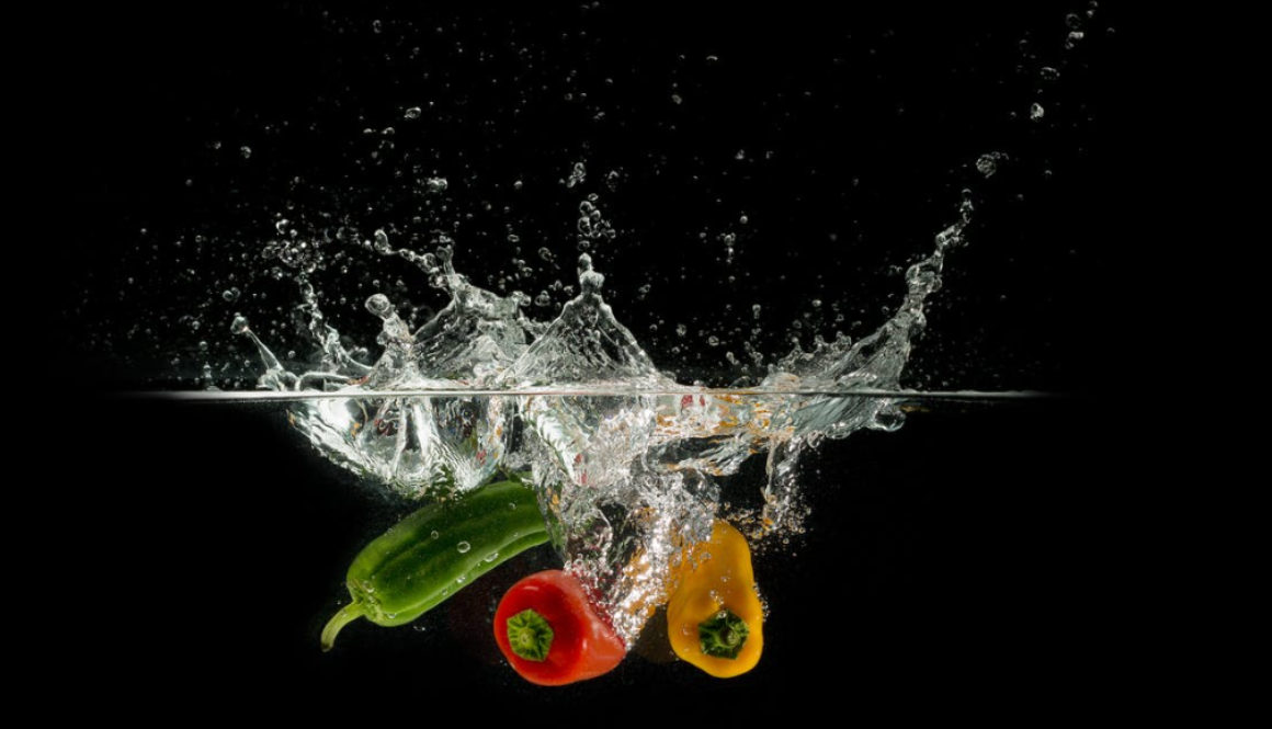 peppers splashing into water
